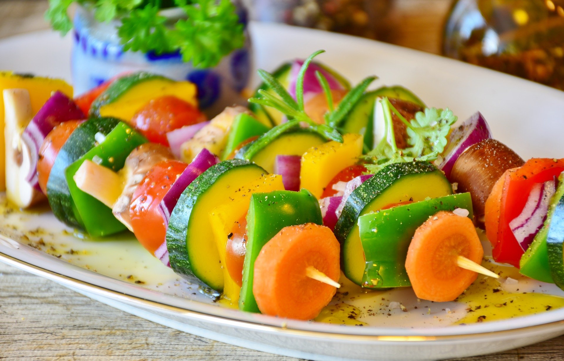 Colorful vegetable skewers with peppers, zucchini and fresh herbs